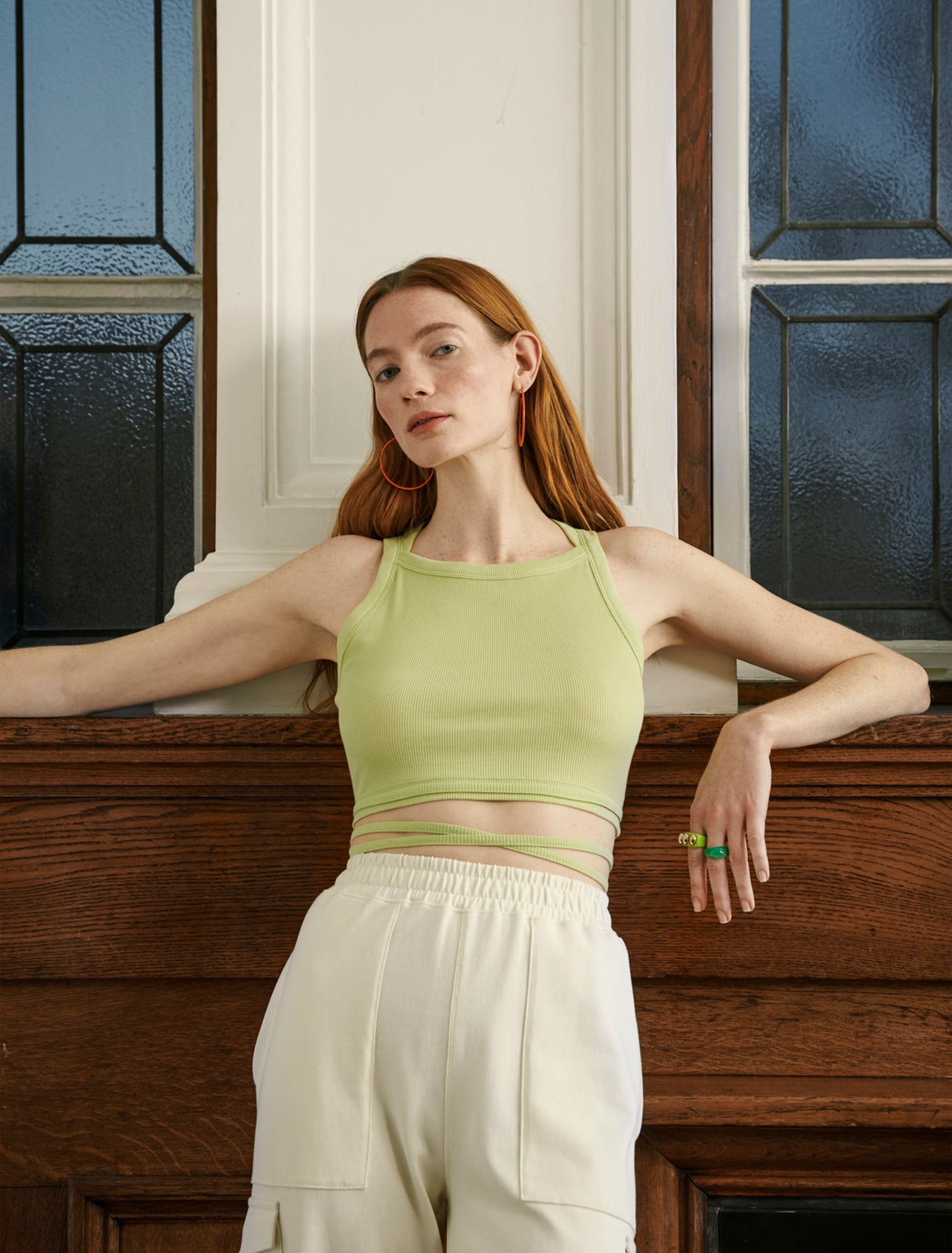 A lady wears a crop top by fair trade, sustainable and organic fashion brand Ninety Percent.